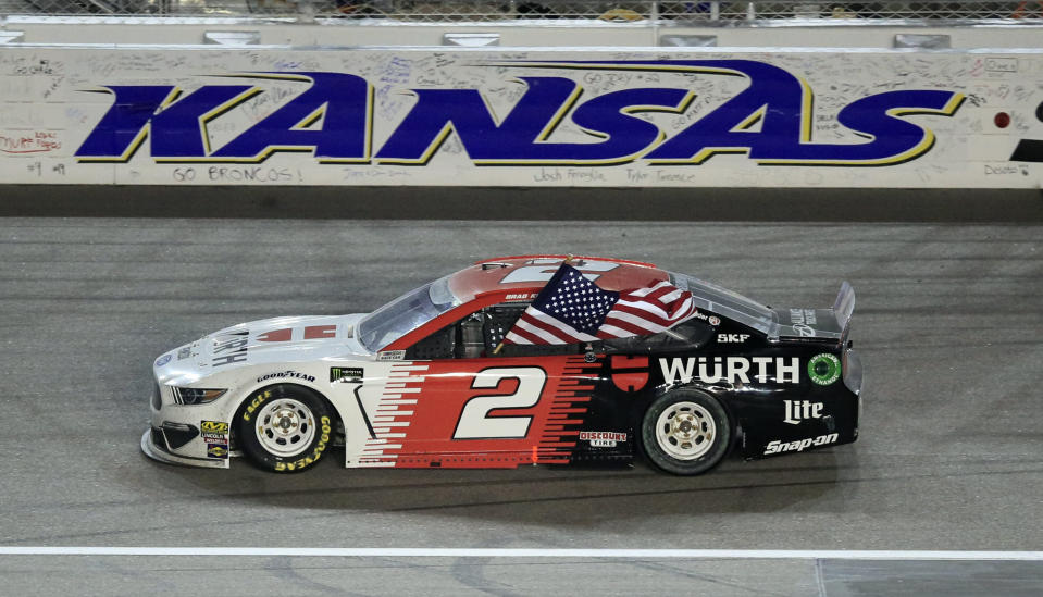 Brad Keselowski (2) celebrates after winning the NASCAR Cup Series auto race at Kansas Speedway in Kansas City, Kan., Saturday, May 11, 2019. (AP Photo/Orlin Wagner)