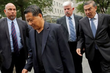 Macau real estate developer Ng Lap Seng (2nd L), accused of bribing former United Nations General Assembly president John Ashe, exits U.S Federal Court in the Manhattan borough of New York, U.S., June 27, 2016. REUTERS/Andrew Kelly