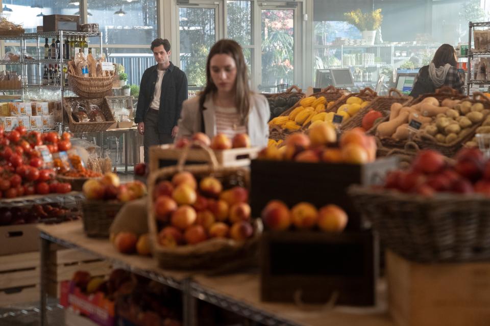 Joe watching a woman in a grocery store