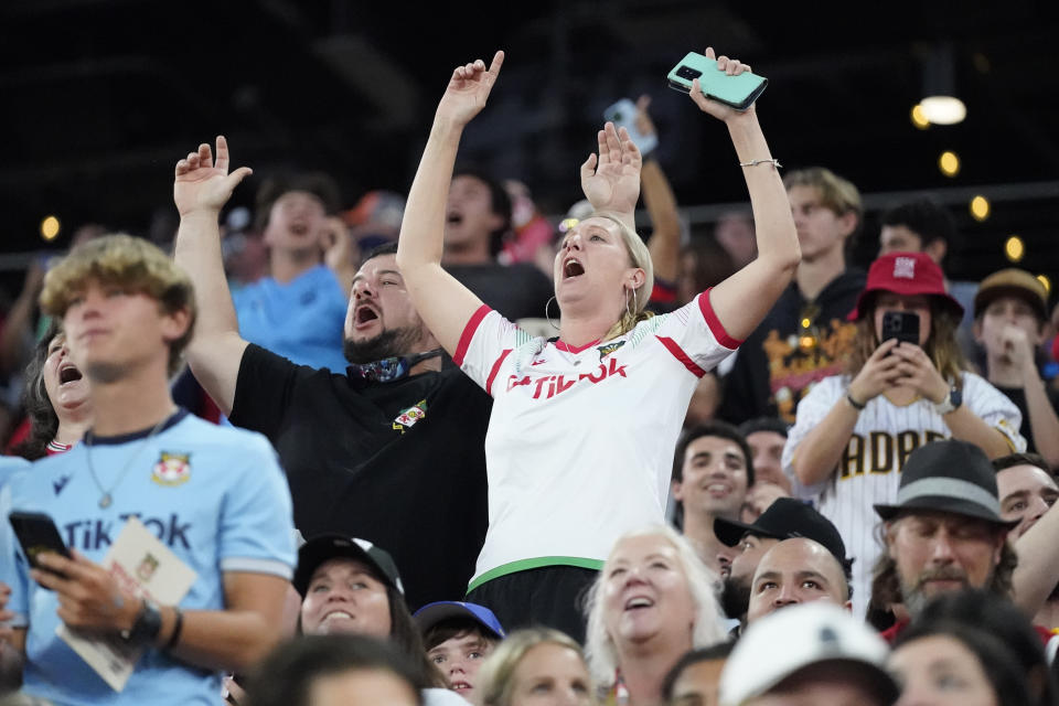 Wrexham fans cheer during the first half of a club friendly soccer match against Manchester United, Tuesday, July 25, 2023, in San Diego. (AP Photo/Gregory Bull)