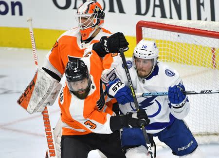 Feb 19, 2019; Philadelphia, PA, USA; Philadelphia Flyers defenseman Radko Gudas (3) battles with Tampa Bay Lightning center J.T. Miller (10) in front of goaltender Brian Elliott (37) during the third period at Wells Fargo Center. Mandatory Credit: Eric Hartline-USA TODAY Sports