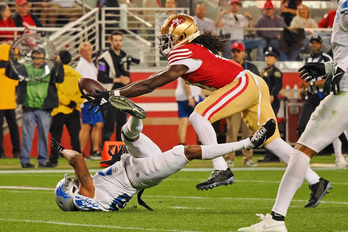 San Francisco 49ers wide receiver Brandon Aiyuk (11) catches a ball that bounced off the face mask of Detroit Lions cornerback Kindle Vildor (29) during the second half of the NFC Championship football game Jan. 28, 2024, at Levi’s Stadium in Santa Clara.