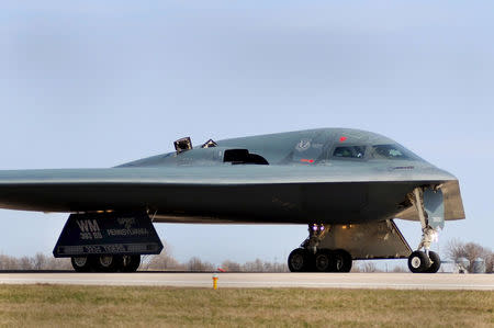 FILE PHOTO: One of three Air Force Global Strike Command B-2 Spirit bombers returns, after striking targets in support of the international response which is enforcing a no-fly zone over Libya, to home base at Whiteman Air Force Base in Missouri, U.S., March 20, 2011 via REUTERS/File Photo