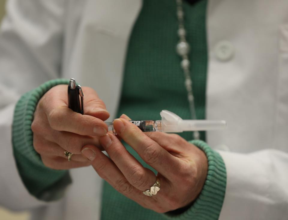 Rockland Department of Health nurse Bonnie Sullivan, RN prepares a flu shot to give to a patient during a free clinic for residents at the Martin Luther King Multi-Purpose Center in Spring Valley Feb. 13, 2019. 