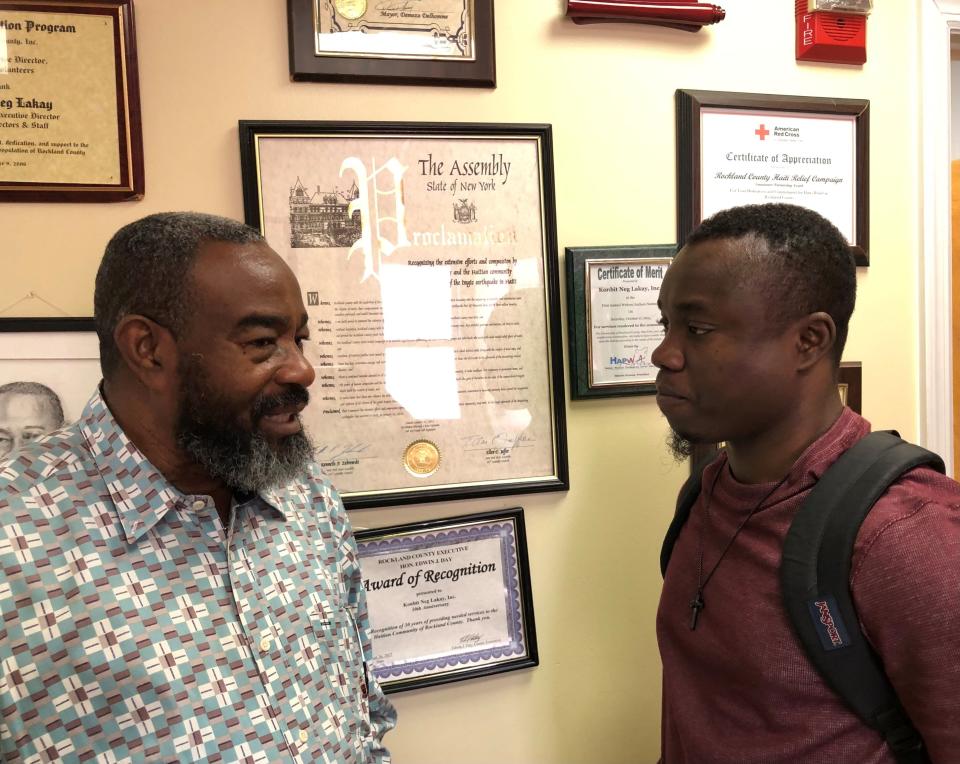 Konbit Neg Lakay CEO Renold Julien speaks with Renel Ilorme during an Oct. 3, 2023, job fair that Konbit hosted for Uneeda Enterprizes. Ilorme came to the U.S. in April 2023 from Grand Goave, Haiti.