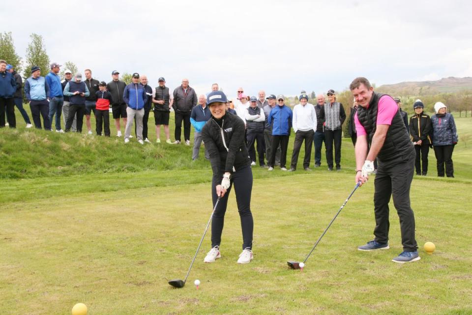 Pictured on the 13th tee at Skipton Golf Club when the new 2024 season officially teed-off are Men's and Ladies' Captains Ollie Burton and Sarah Howes, closely watched by some of the members.