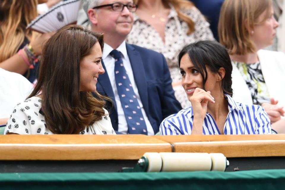 <p>The Duchess of Sussex discreetly says something to her sister-in-law. We seriously need a lipreader right now.</p>