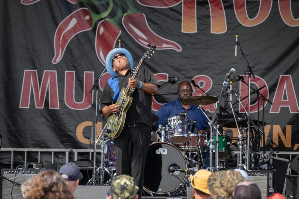 Willie J Laws performing with his band at a recent music festival.
