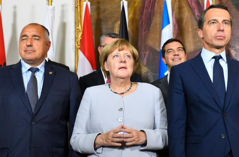 (L-R) Bulgaria's Prime Minister Boyko Borissov, German Chancellor Angela Merkel and Austrian Chancellor Christian Kern pose for a family photo after a meeting on the Balkan migrant route into the EU in Vienna on September 24, 2016