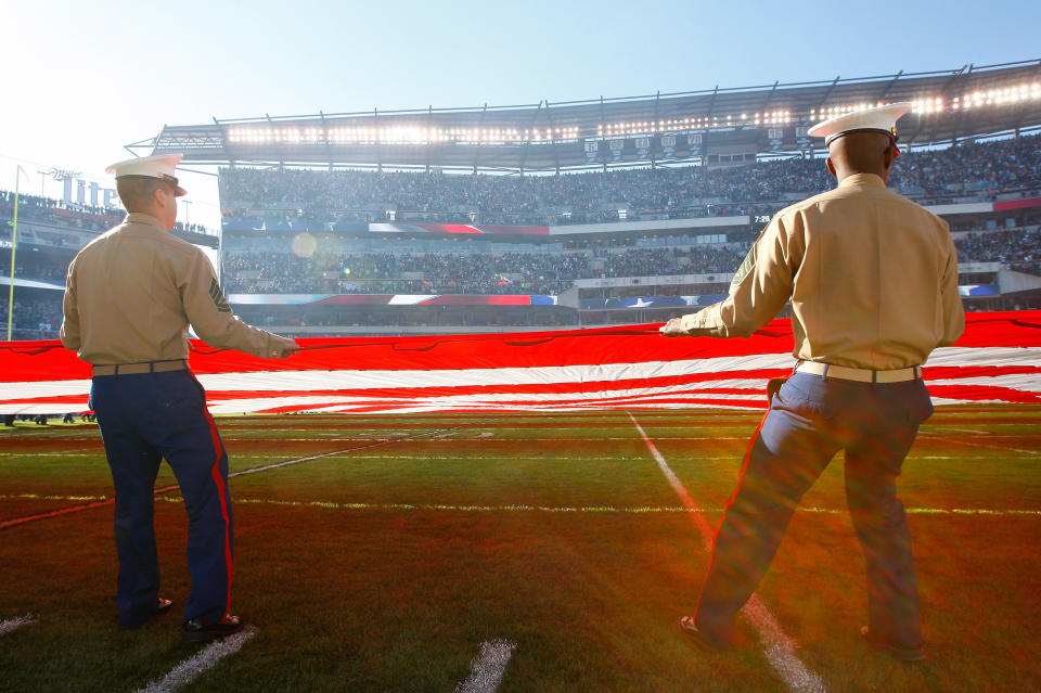 PHILADELPHIA, PA - NOVEMBER 15:  Members of the Military hold an American Flag as the National Anthem is performed before the Philadelphia Eagles take on the Miami Dolphins at Lincoln Financial Field on November 15, 2015 in Philadelphia, Pennsylvania.  (Photo by Rich Schultz/Getty Images)