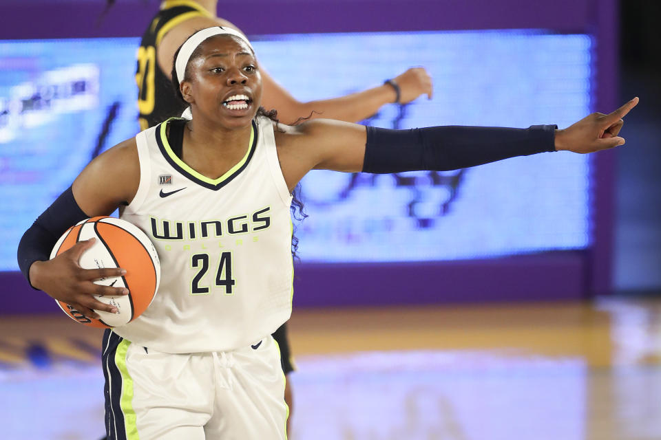 LOS ANGELES, CALIFORNIA – MAY 14: Guard Arike Ogunbowale #24 of the Dallas Wings handles the ball during the game against the <a class="link " href="https://sports.yahoo.com/wnba/teams/los" data-i13n="sec:content-canvas;subsec:anchor_text;elm:context_link" data-ylk="slk:Los Angeles Sparks;sec:content-canvas;subsec:anchor_text;elm:context_link;itc:0">Los Angeles Sparks</a> at Los Angeles Convention Center on May 14, 2021 in Los Angeles, California. (Photo by Meg Oliphant/Getty Images)