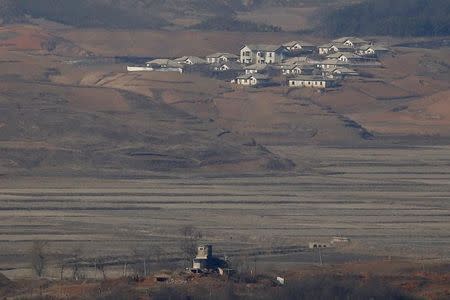 A North Korean guard post (bottom) is seen in front of the North Korea's propaganda village Kaepoong in this picture taken from the Unification Observation Platform, near the demilitarized zone which separates the two Koreas in Paju, South Korea, January 7, 2016. REUTERS/Kim Hong-Ji