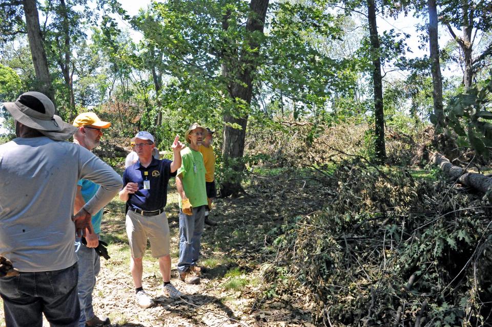 John Heading lays out a plan of attack on the yard at the Pfalzgraf house.