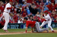 Pete Kozma #38 of the St. Louis Cardinals tags out Bryce Harper #34 of the Washington Nationals at third base as David Freese #23 reacts in the seventh inning during Game Two of the National League Division Series at Busch Stadium on October 8, 2012 in St Louis, Missouri. (Photo by Jamie Squire/Getty Images)