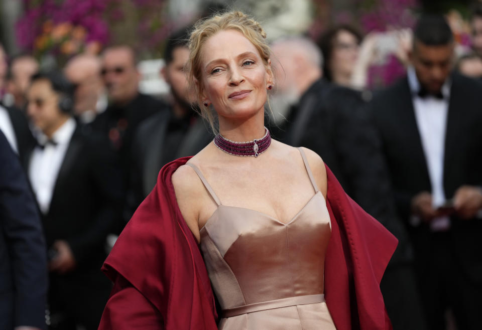 Uma Thurman poses for photographers upon arrival at the opening ceremony and the premiere of the film 'Jeanne du Barry' at the 76th international film festival, Cannes, southern France, Tuesday, May 16, 2023. (Photo by Scott Garfitt/Invision/AP)