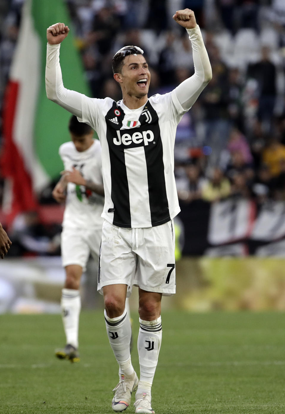 Juventus' Cristiano Ronaldo celebrates at the end of a Serie A soccer match between Juventus and AC Fiorentina, at the Allianz stadium in Turin, Italy, Saturday, April 20, 2019. Juventus clinched a record-extending eighth successive Serie A title, with five matches to spare, after it defeated Fiorentina 2-1. (AP Photo/Luca Bruno)