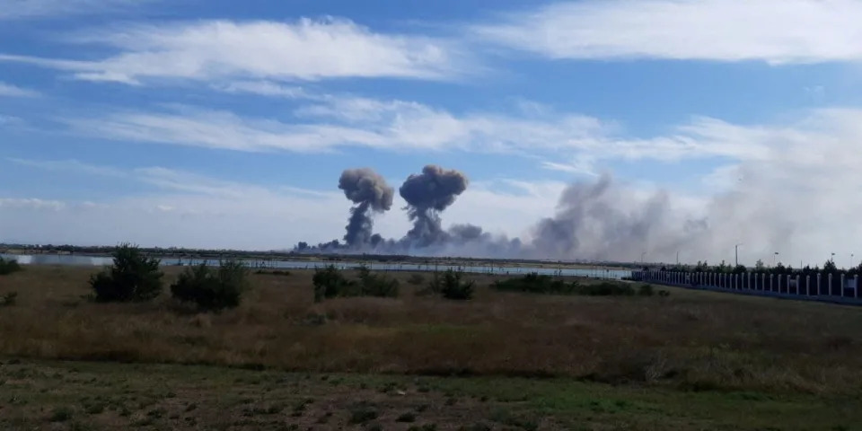 Smoke rises after explosions were heard from the direction of a Russian military airbase near Novofedorivka, Crimea, in this still image obtained by Reuters August 9, 2022.