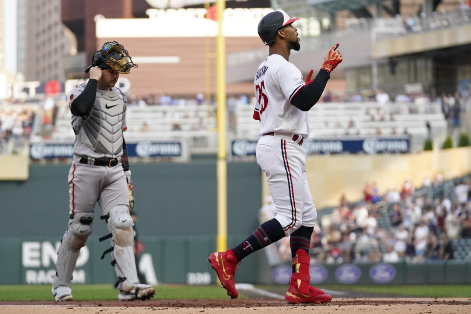 Minnesota Twins designated hitter Byron Buxton celebrates while crossing home plate after hitting a two-run home run against the San Francisco Giants during the first inning of a baseball game, Tuesday, May 23, 2023, in Minneapolis. (AP Photo/Abbie Parr)