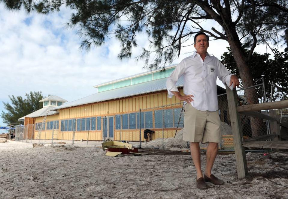 Ed Chiles stands on the beach by his restaurant, the Sandbar, which was undergoing extensive renovations to the dining room in 2013.