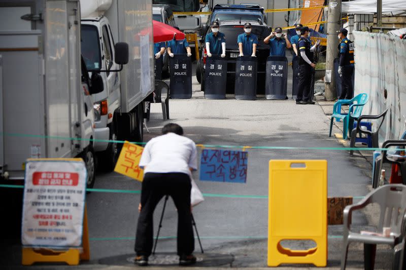 South Korean police stand guard near the Sarang Jeil Church, which has become a new cluster of coronavirus disease (COVID-19) infections, in Seoul