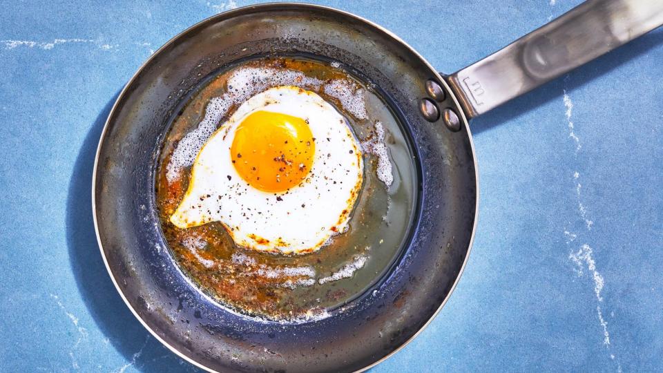 carbon steel pan with fried egg