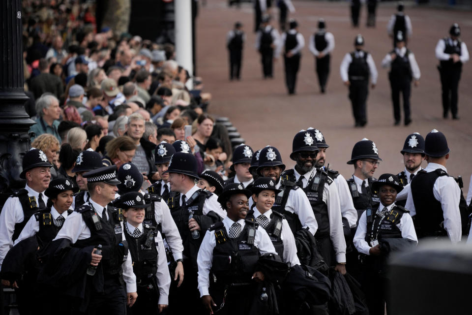 <p>Police officers gather outside Buckingham Palace from where the coffin of late Queen Elizabeth II will depart in procession to Westminster Hall in London, Wednesday, Sept. 14, 2022. Vadim Ghirda/Pool via REUTERS</p> 