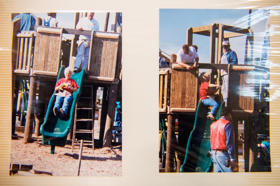 Photos of the preparation and construction of the Claxton playground in 2000 are displayed in a photo album kept at the Claxton Community Center.