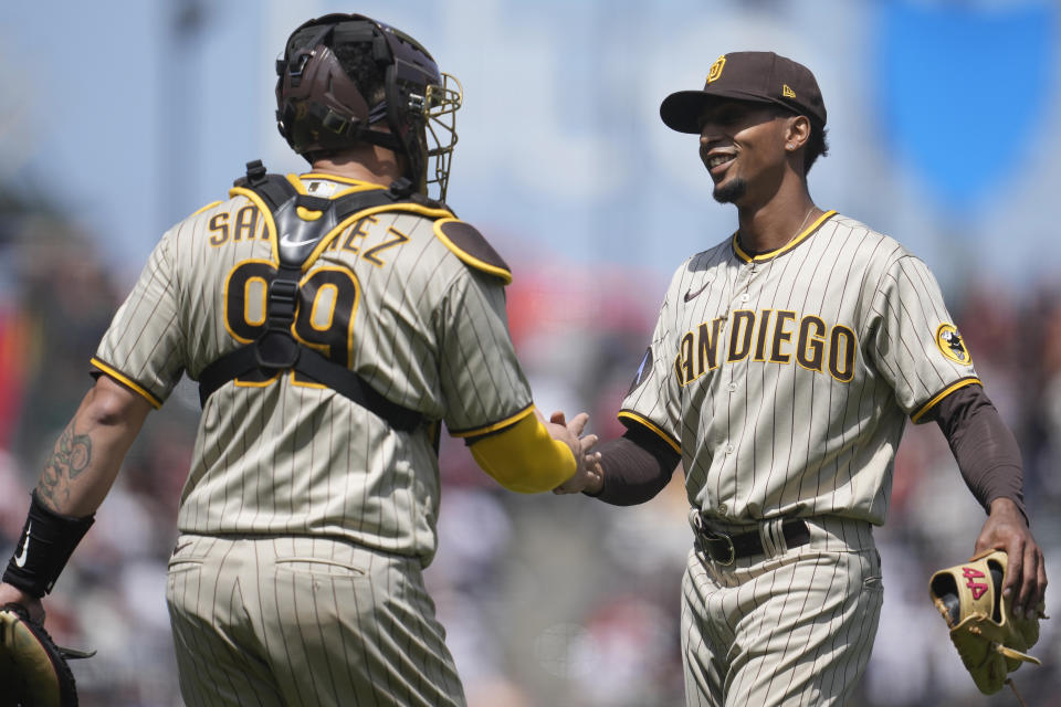 San Diego Padres catcher Gary Sanchez (99) celebrates with pitcher Ray Kerr after the Padres defeated the San Francisco Giants in a baseball game in San Francisco, Thursday, June 22, 2023. (AP Photo/Jeff Chiu)