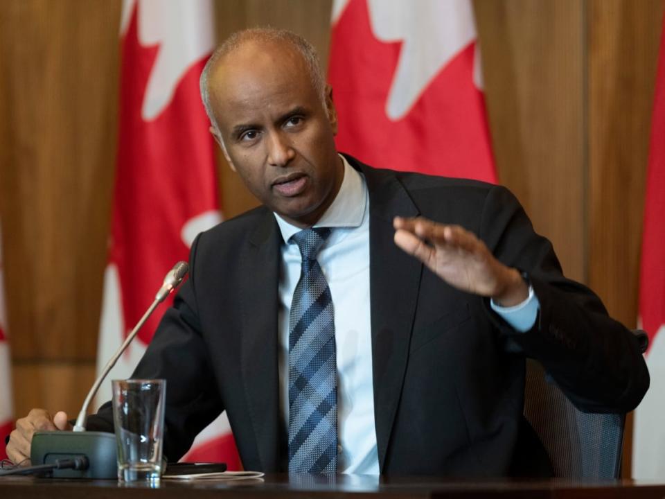 Housing and Diversity and Inclusion Minister Ahmed Hussen speaks during a news conference in Ottawa on Feb. 15. Hussen announced Monday that the government would ease some restrictions on foreign ownership of residential property. (Adrian Wyld/The Canadian Press - image credit)