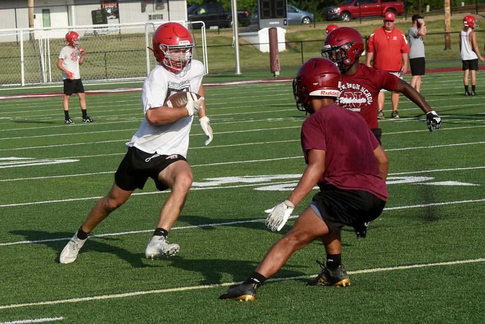 Johnstown senior Garrett Grinstead turns upfield after making a catch in the flat during a July passing scrimmage against Newark. Grinstead also is a standout defensive end.