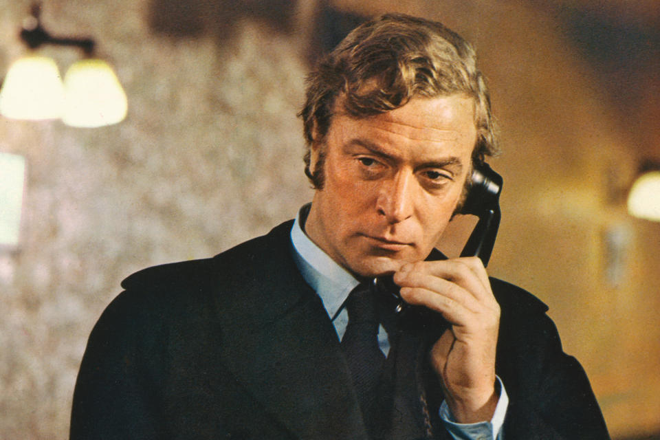 Michael Caine, British actor, wearing a black raincoat and holding a black telephone receiver in a publicity still issued for the film, 'Get Carter', United Kingdom, 1971. The crime thriller, directed by Mike Hodges, starred Caine as 'Jack Carter'. (Photo by Silver Screen Collection/Getty Images) (Silver Screen Collection / Getty Images file)