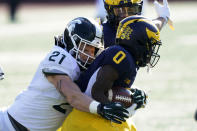 Michigan State linebacker Chase Kline (21) tackles Michigan wide receiver Giles Jackson (0) during the first half of an NCAA college football game, Saturday, Oct. 31, 2020, in Ann Arbor, Mich. (AP Photo/Carlos Osorio)