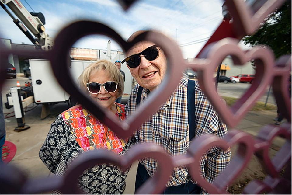 Kathy and Bob Thomas celebrate the installation of a work of public art called "Key to my Heart" in downtown Edmond in November 2020. Both have since passed away.