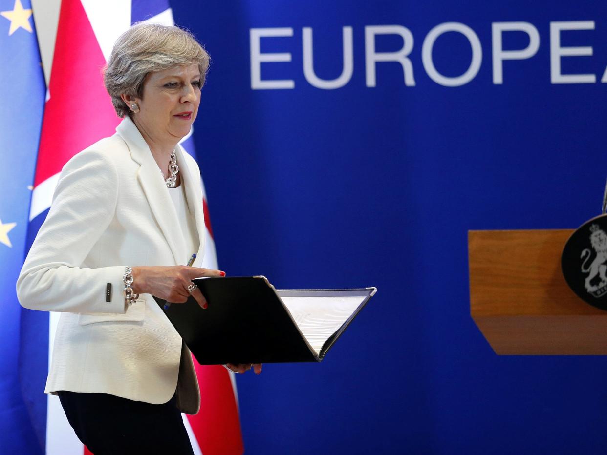 Theresa May arrives at a news conference at the EU summit in Brussels: REUTERS