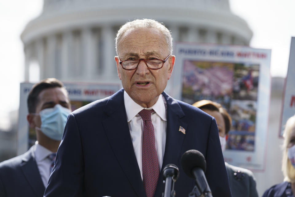 Senate Majority Leader Chuck Schumer, D-N.Y., joins advocates for Puerto Rico, which still suffers from the effects of Hurricane Maria in 2017, at the Capitol in Washington, Monday, Sept. 20, 2021. Schumer said it was "extremely disappointing" that the Senate's nonpartisan parliamentarian ruled Democrats can't use their $3.5 trillion package bolstering social and climate programs to give millions of immigrants a chance to become citizens. (AP Photo/J. Scott Applewhite)