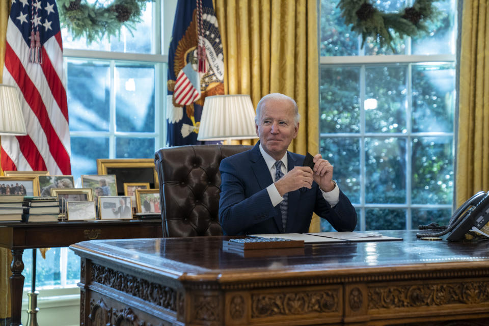 President Joe Biden speaks before signing an executive order to improve government services, in the Oval Office of the White House, Monday, Dec. 13, 2021, in Washington. (AP Photo/Evan Vucci)