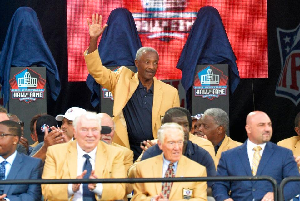 Enshrinee Paul Warfield is introduced during the Pro Football Hall of Fame enshrinement ceremony Saturday, Aug. 2, 2014, in Canton.