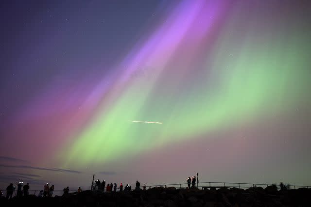 <p>Ian Forsyth/Getty</p> The northern lights spotted in Whitley Bay, England on May 10, 2024