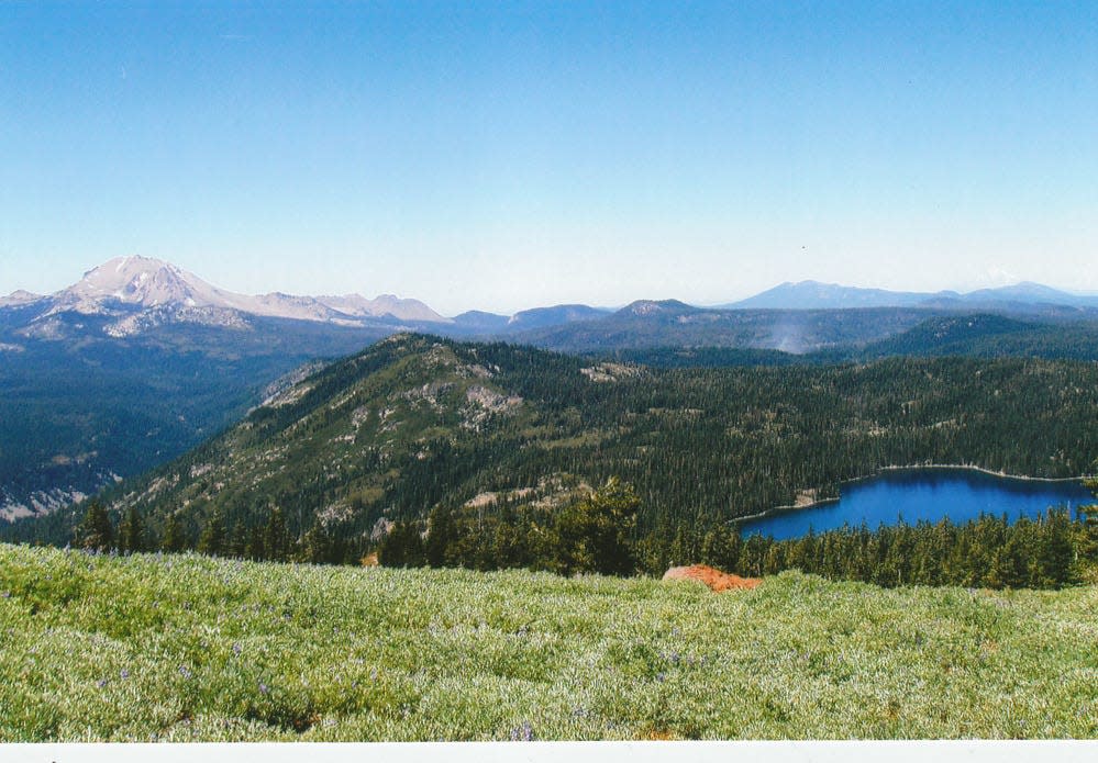 Lassen Peak and Juniper Lake are seen from the slopes of Mount Harkness at Lassen Volcanic National Park.