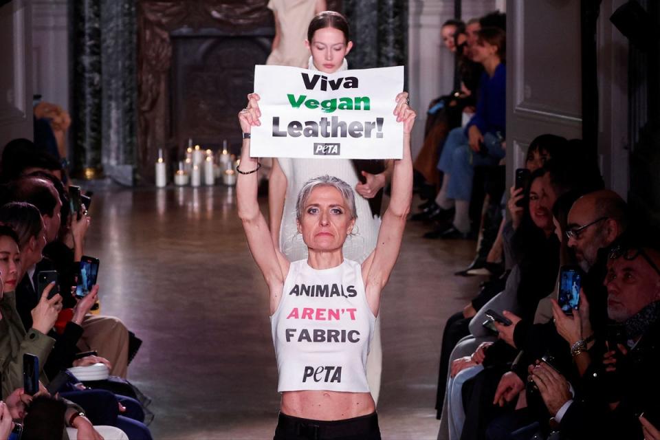 A PETA protestor on the catwalk during Victoria Beckham's Paris Fashion Week show (REUTERS)