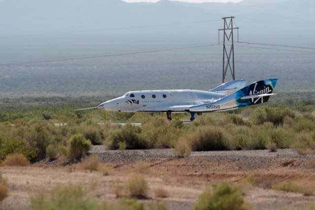 The Virgin Galactic rocket plane, with founder Sir Richard Branson and other crew members on board, lands back in Spaceport America, New Mexico