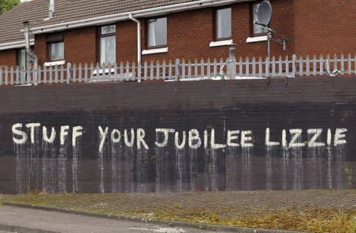 Anti-monarchy graffiti pictured on a wall in west Belfast, Northern Ireland. Queen Elizabeth II is poised to make a historic gesture in Northern Ireland's peace process when she shakes the hand of former IRA commander Martin McGuinness