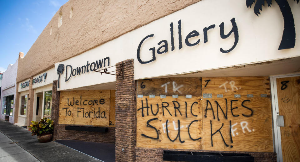 Florida graffiti on boarded-up wall as residents braced for Hurricane Dorian.