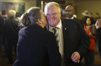 Toronto Mayor Rob Ford (R) greets a supporter at his campaign launch party in Toronto, April 17, 2014. The Toronto municipal election is set for October 2014.