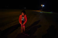 Emely, 8, of Honduras, waits at an intake area after turning herself in upon crossing the U.S.-Mexico border Wednesday, May 12, 2021, in La Joya, Texas. Growing numbers of migrant families are making the heart-wrenching decision to separate from their children and send them into the U.S. alone. (AP Photo/Gregory Bull)