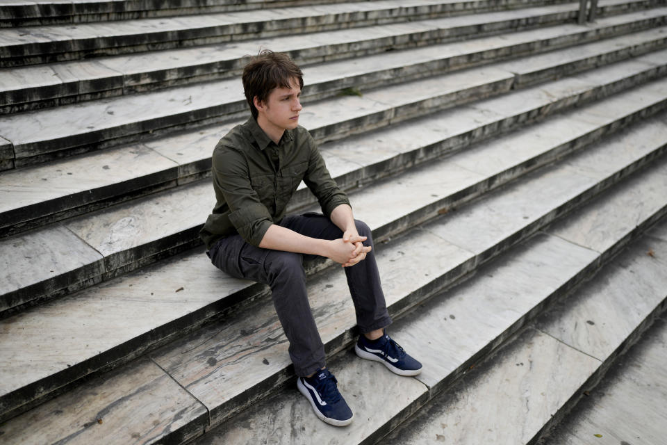 Juan Castelli sits on a staircase at a square in Montevideo, Uruguay, Saturday, July 22, 2023. Castelli was raised in a Catholic household, but has been an atheist since the age of 15. Uruguay, has a long history of secularization that dates to the early 20th century. Today, more than half of its population identify as atheist, agnostic or religiously unaffiliated – the highest portion in Latin America. (AP Photo/Natacha Pisarenko)