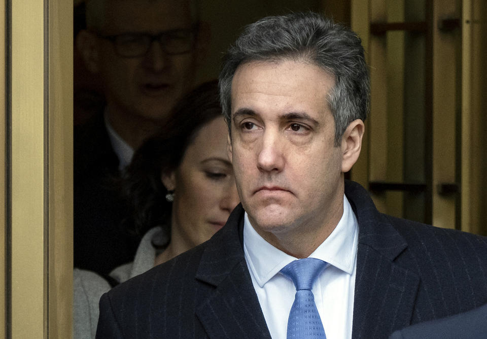 FILE- In this Dec. 12, 2018 file photo, President Donald Trump's former lawyer, Michael Cohen, leaves federal court in New York after being sentenced to three years in prison. Cohen was furloughed from prison in May 2020 as authorities tried to slow the spread of the coronavirus in federal prisons, but was returned to prison because he refused to sign an agreement over terms of his home confinement, not because he planned to publish a book critical of Trump, prosecutors said Wednesday, July 22, 2020. (AP Photo/Craig Ruttle, File)