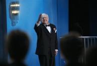 Actor Mickey Rooney waves to the audience as he presents the award for Outstanding Female Actor in a TV Movie or Miniseries at the 14th annual Screen Actors Guild Awards in Los Angeles in this January 27, 2008 file photo. REUTERS/Mario Anzuoni/Files