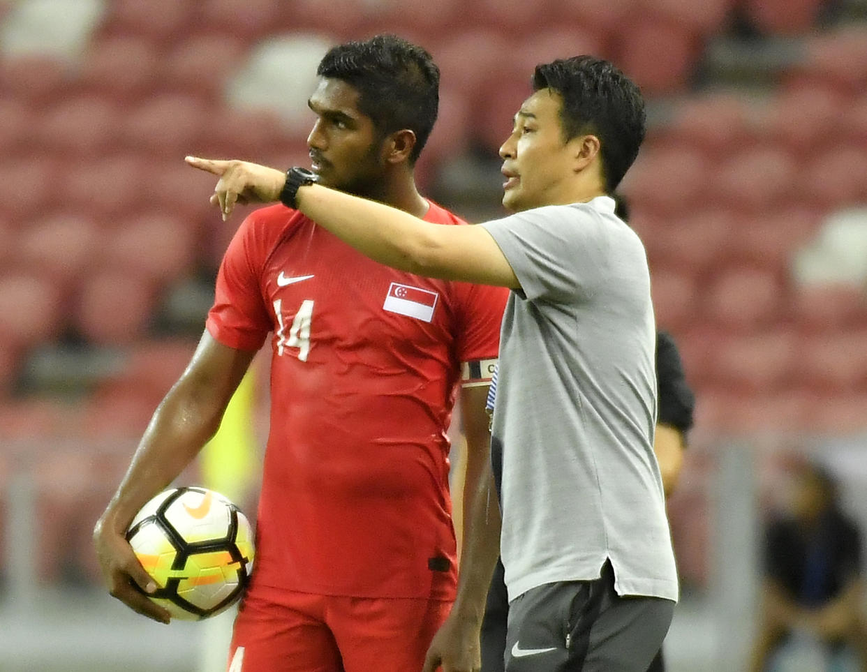 Singapore nationl football head coach Tatsuma Yoshida with captain Hariss Harun. (PHOTO: PictoBank/Getty Images)