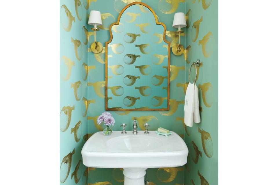 <p><b>Fish: </b>In a Florida Gulf-front home, gilded puffer fish swim past brassy sconces and an antiqued bronze mirror for a sophisticated take on underwater style.</p>